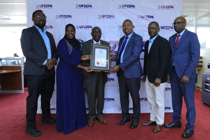 UHB presenting a halal certificate to UFZEPA leadership