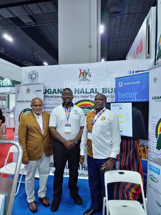 Three members of the Uganda delegation at the UHB stand, MIHAS 2025